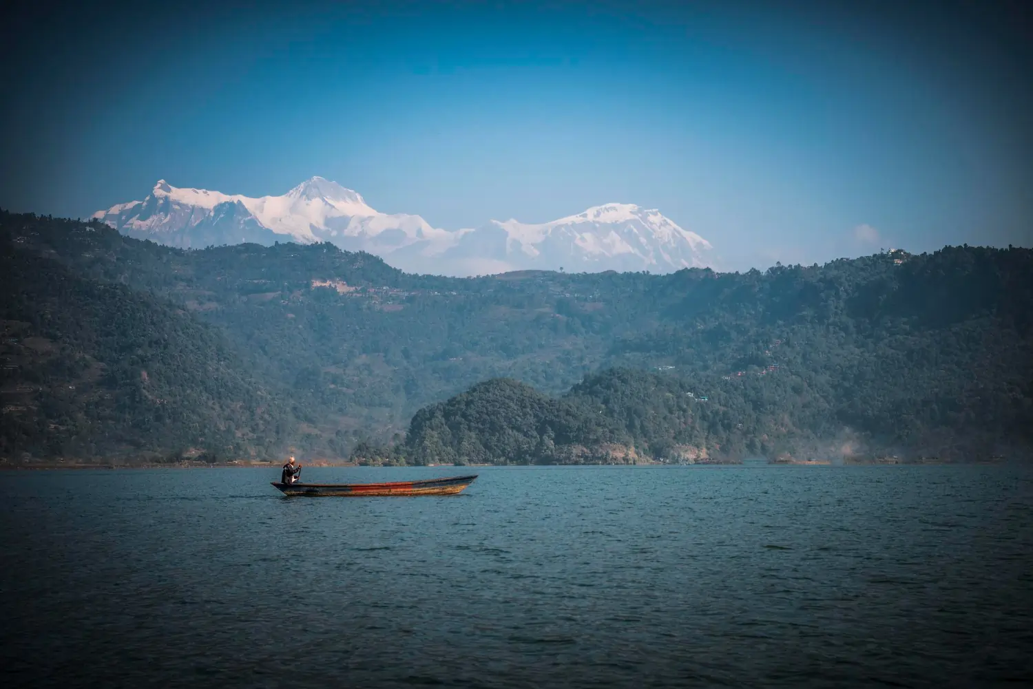 Fisherman on Traditional Wooden Boat, Fewa Lake, Pokhara.webp